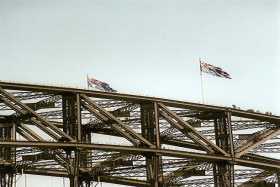 Bridge climbers reach the apex of the Coathanger Bridge climbers reach the apex of the Coathanger