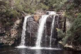 A waterfall in Cradle Mountain-Lake St Claire National Park A waterfall in Cradle Mountain-Lake St Claire National Park