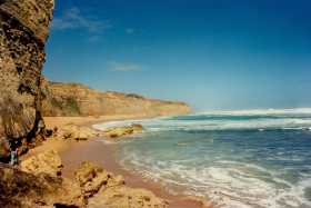 The massive limestone cliffs dominate Gibson Beach
