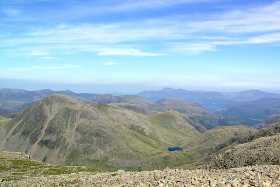 The fells north-west of Scafell Pike, including Great Gable, and Skiddaw on the horizon The fells north-west of Scafell Pike, including Great Gable, and Skiddaw on the horizon