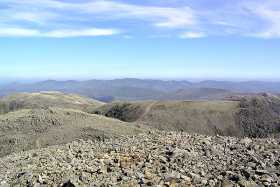 The view to the north from Scafell Pike, with the Helvellyn range on the horizon The view to the north from Scafell Pike, with the Helvellyn range on the horizon