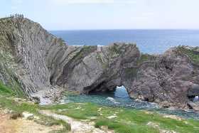 The Purbeck limestone at Stair Hole exhibits folding due to plate tectonics