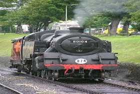 A steam locomotive positioning at Swanage Railway station