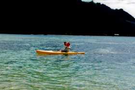 Taking a sea kayak across to Waya from Kuata Island